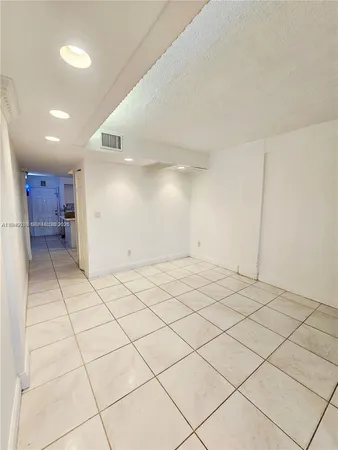 a hallway with washer and dryer