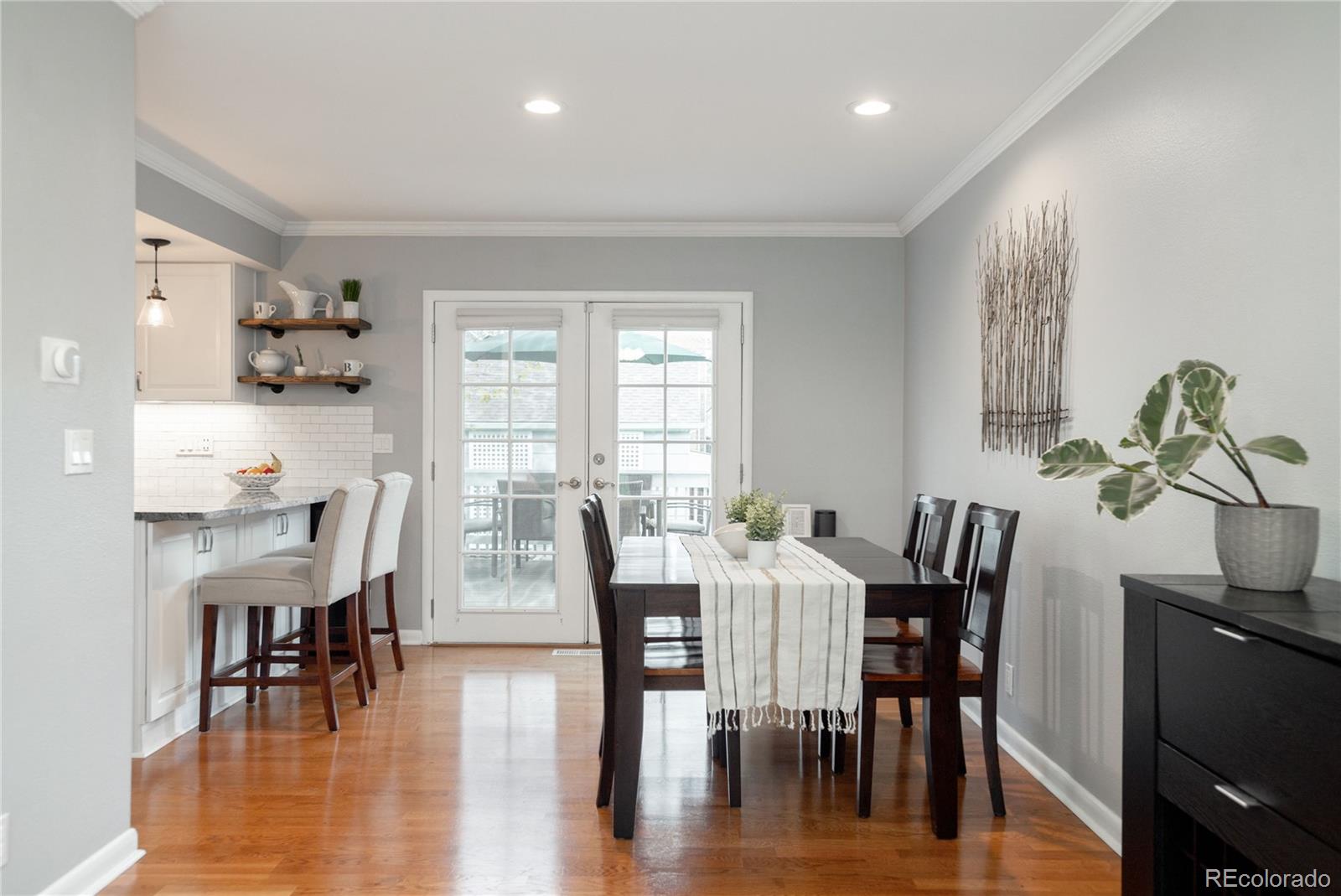 2696 Perry Street Denver, CO 80212 - Photo 14 of 40 a view of a dining room with furniture window and wooden floor