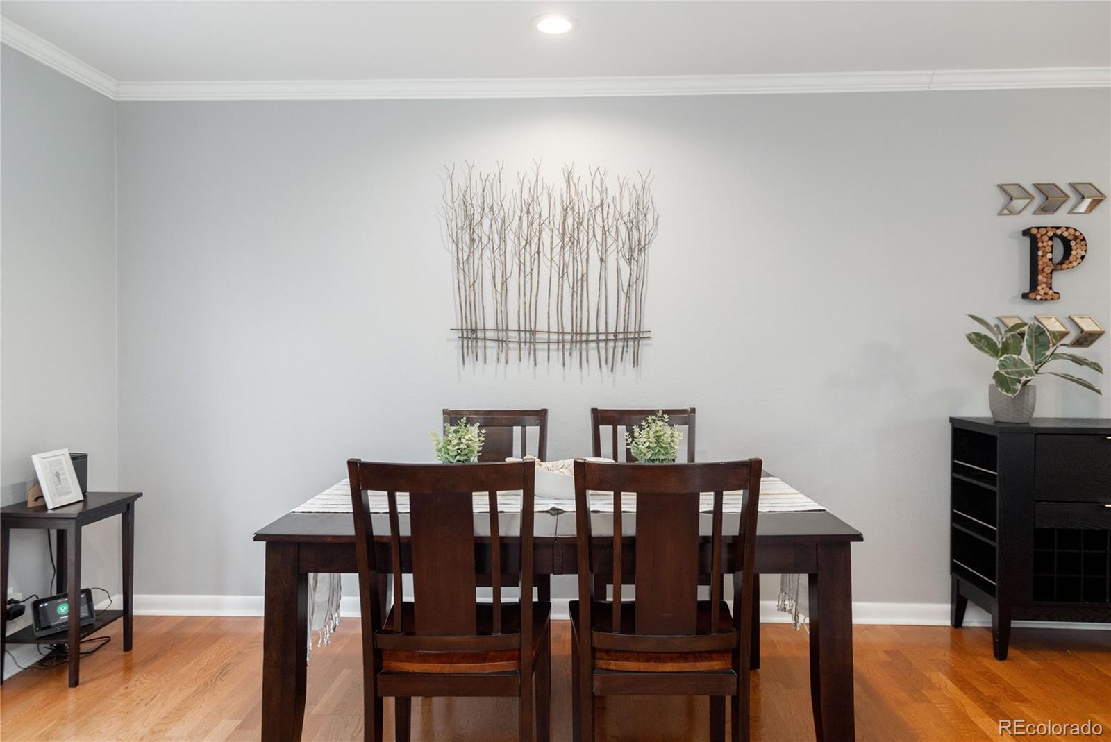 2696 Perry Street Denver, CO 80212 - Photo 15 of 40 a view of a dining room with furniture and wooden floor
