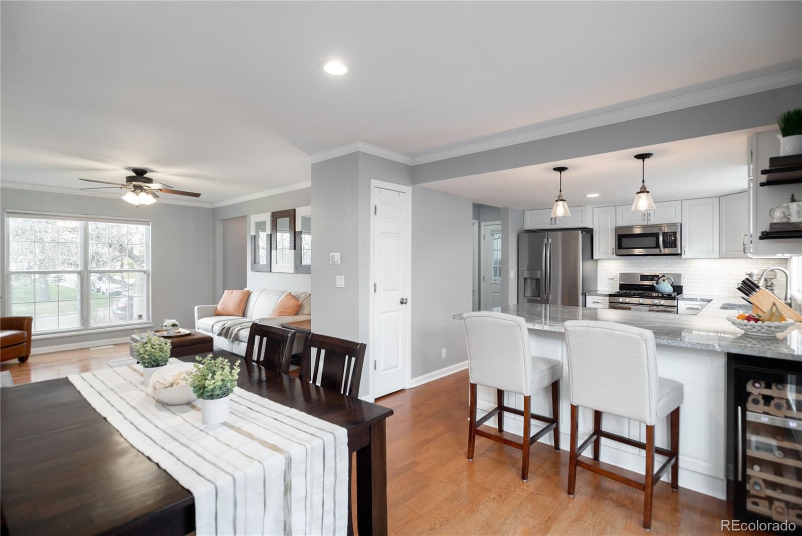 2696 Perry Street Denver, CO 80212 - Photo 16 of 40 a view of a dining room with furniture and wooden floor