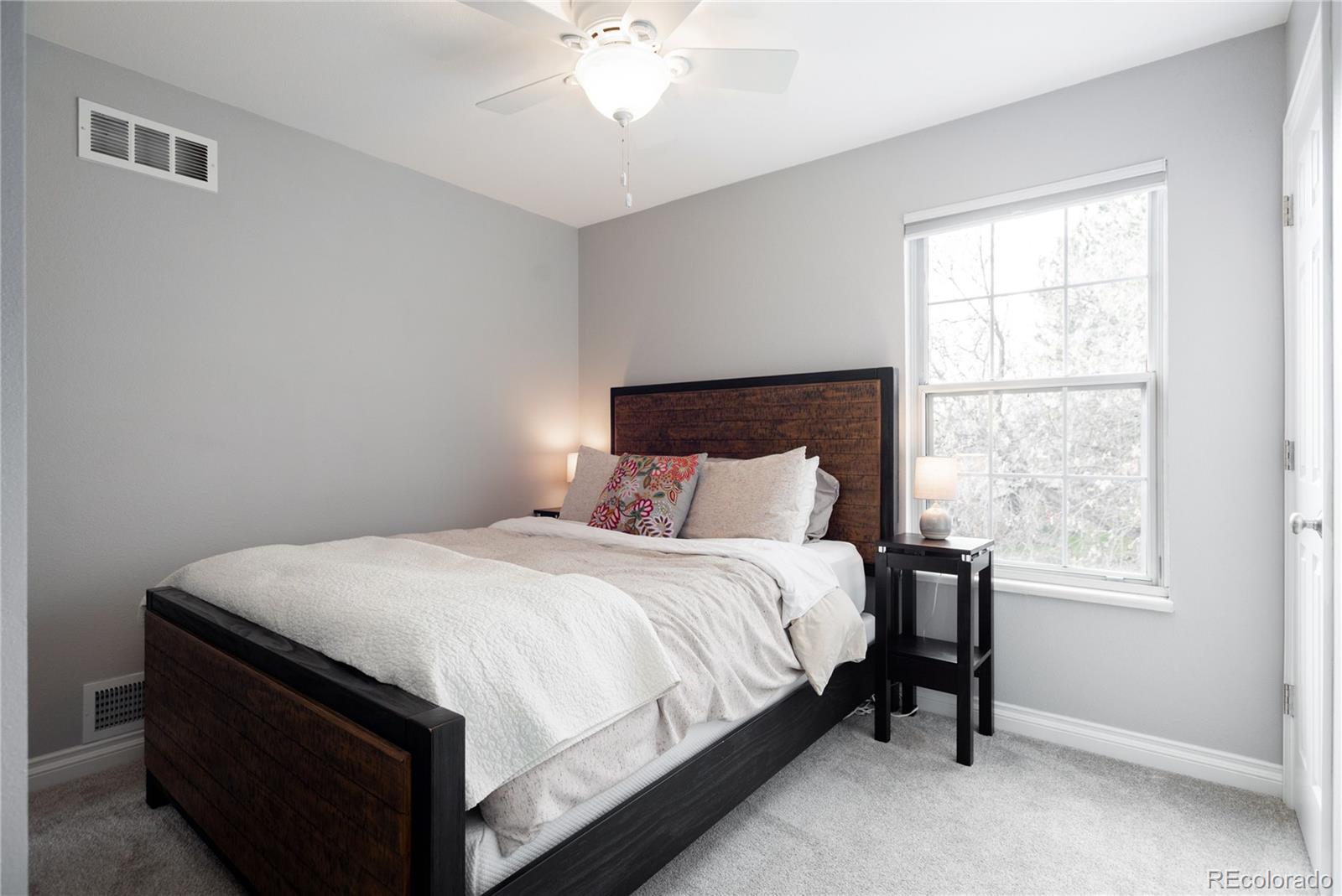 2696 Perry Street Denver, CO 80212 - Photo 27 of 40 a bedroom with a bed and a window