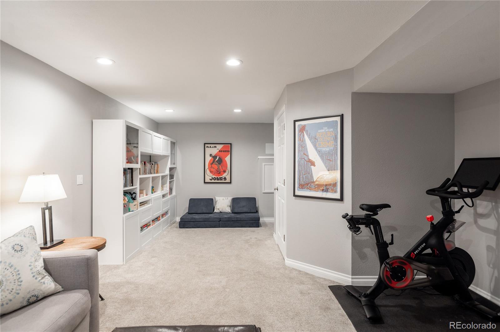 2696 Perry Street Denver, CO 80212 - Photo 33 of 40 a living room with furniture a flat screen tv and a lamp