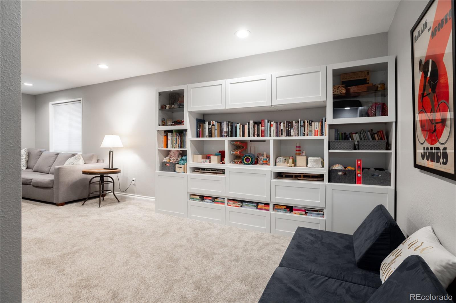 2696 Perry Street Denver, CO 80212 - Photo 34 of 40 a living room with furniture cabinets and white walls