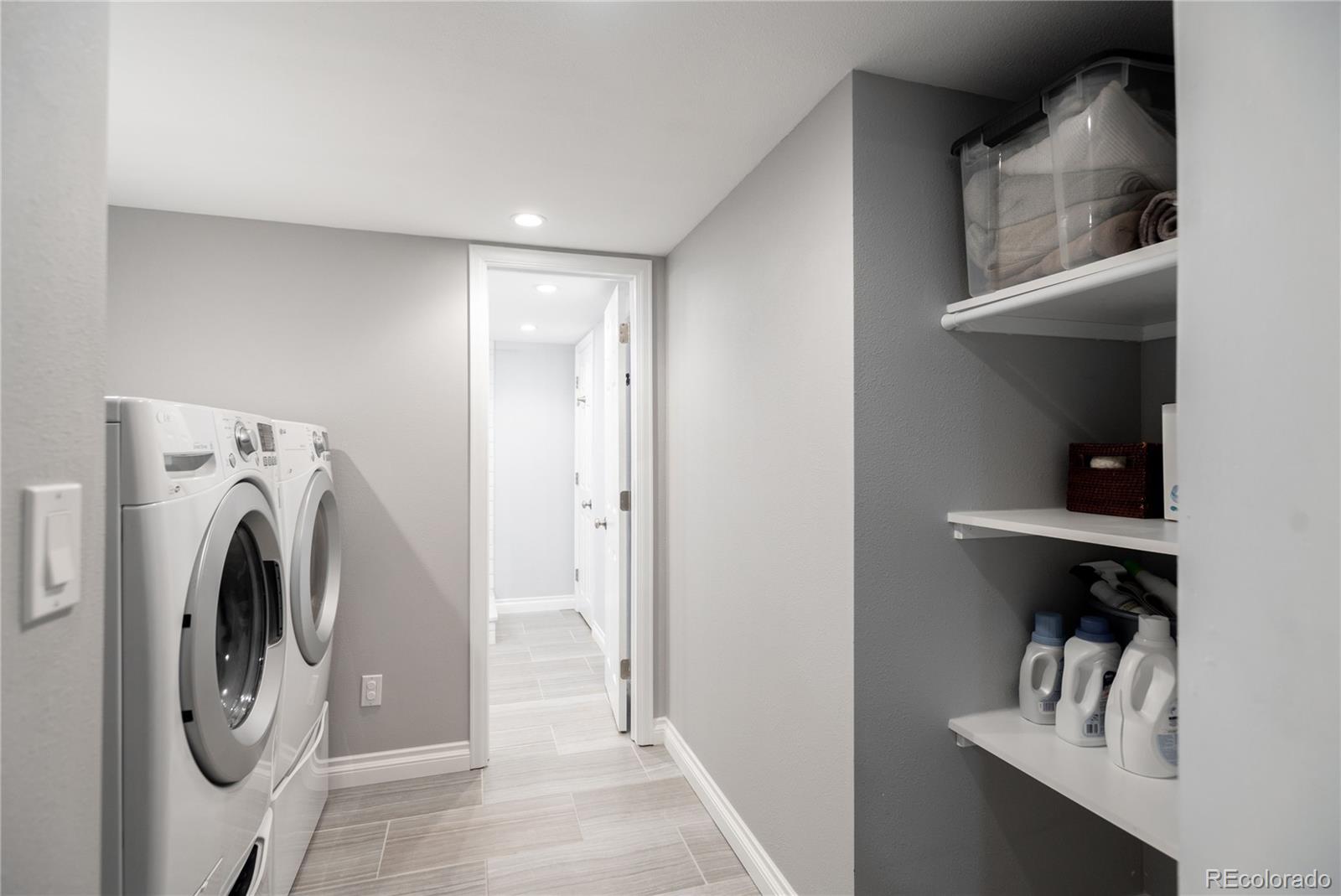 2696 Perry Street Denver, CO 80212 - Photo 36 of 40 a view of storage and utility room with washer and dryer