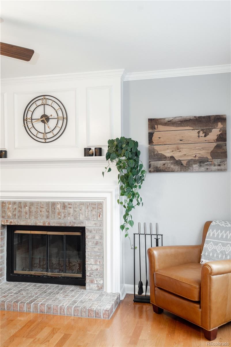 2696 Perry Street Denver, CO 80212 - Photo 9 of 40 a living room with a fireplace furniture and a potted plant