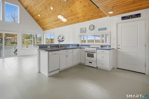 a view of a kitchen with furniture and cabinets
