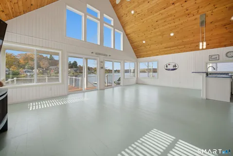 a view of an livingroom with furniture window and wooden floor