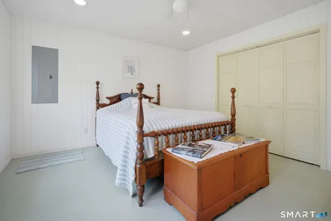 a bed room with a bed and a window