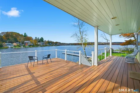 a view of deck with patio and mountain view