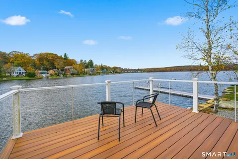 a view of backyard with deck and wooden floor