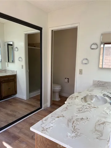 a bedroom with a bed and a fireplace