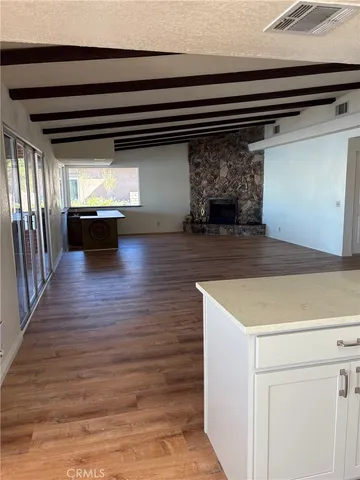 a kitchen with stove and cabinets