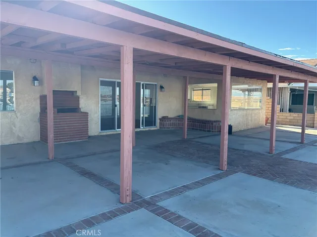 an empty room and wooden floor and windows
