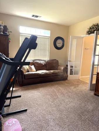 a spacious bathroom with a tub sink and mirror