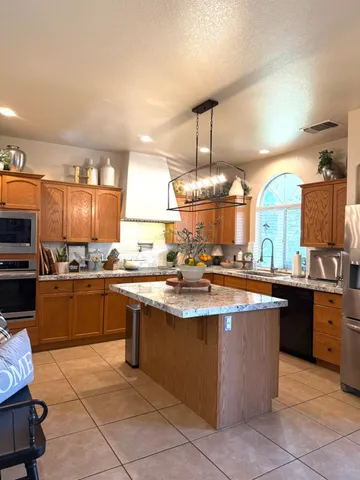 a large kitchen with a large counter top