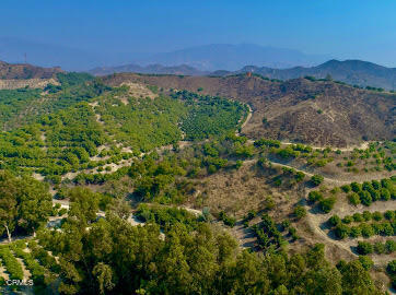 0 Foothill Road Santa Paula, CA 93060 - Photo 6 of 9 a view of a lush green mountain with a building in the background