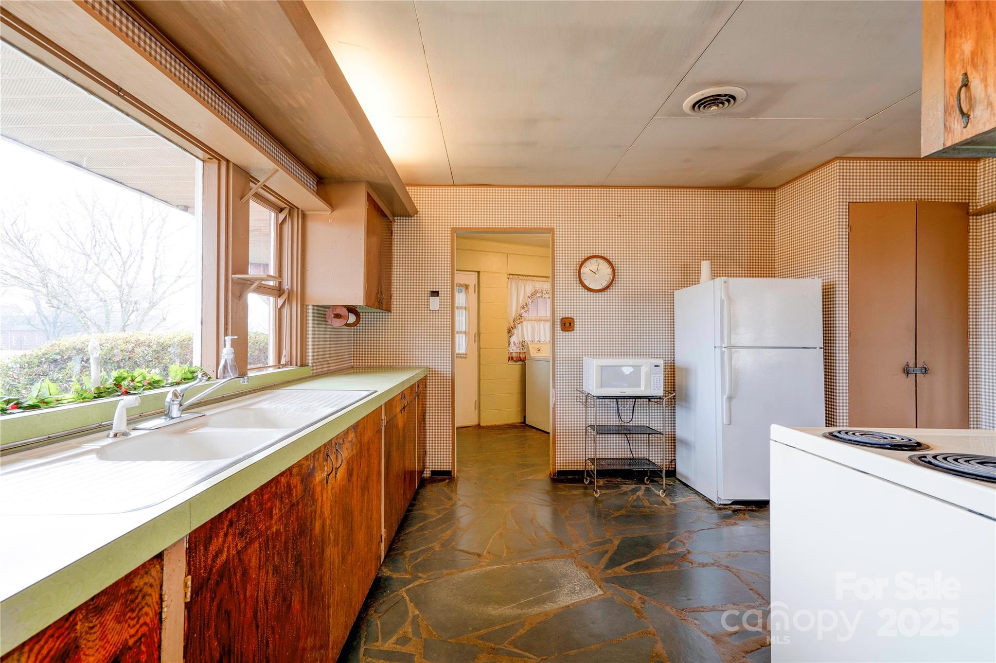 3809 Polkville Road Shelby, NC 28150 - Photo 15 of 48 a kitchen with a refrigerator and a sink