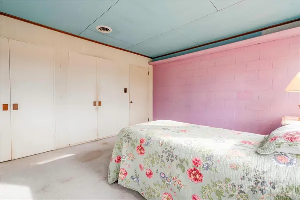 a bedroom with a bed and a bed