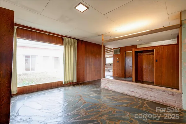 a view of an empty room with a window