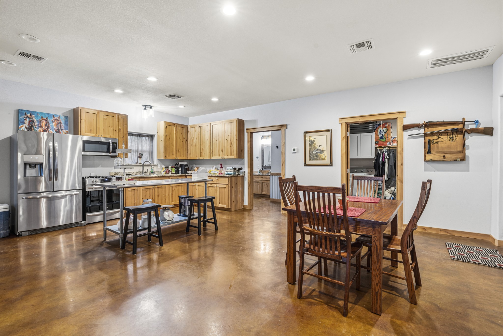 3724 Ranch Road 3347 Round Mountain, TX 78663 - Photo 25 of 40 a view of a dining room with furniture and wooden floor