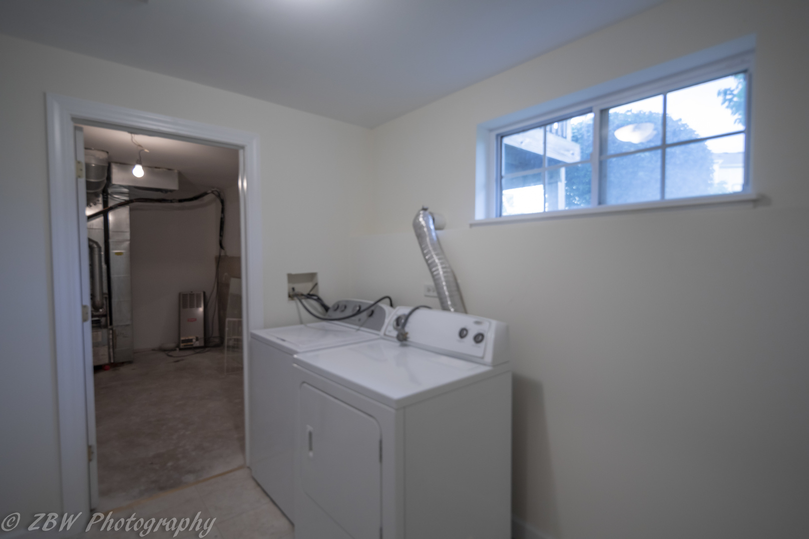 1906 Indian Hill Lane, Unit 1906 Aurora, IL 60503 - Photo 13 of 13 a utility room with a sink dryer and washer