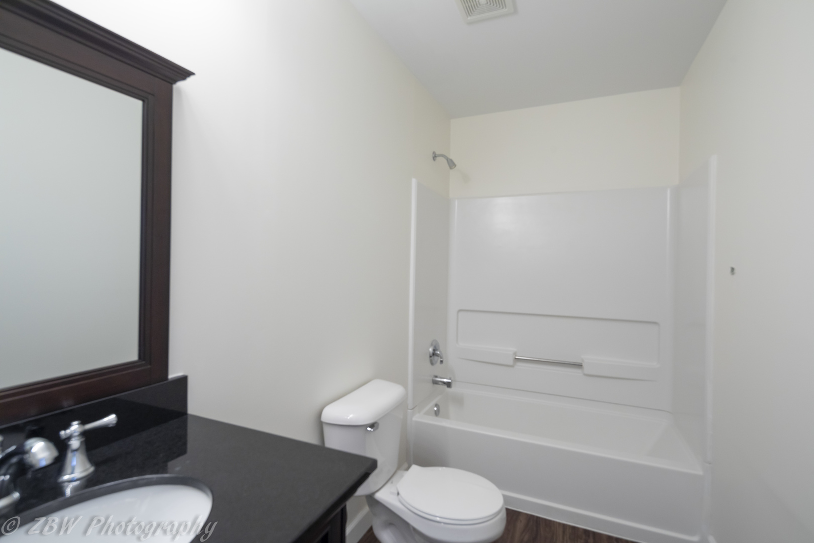 1906 Indian Hill Lane, Unit 1906 Aurora, IL 60503 - Photo 10 of 13 a bathroom with a granite countertop toilet a sink and bathtub