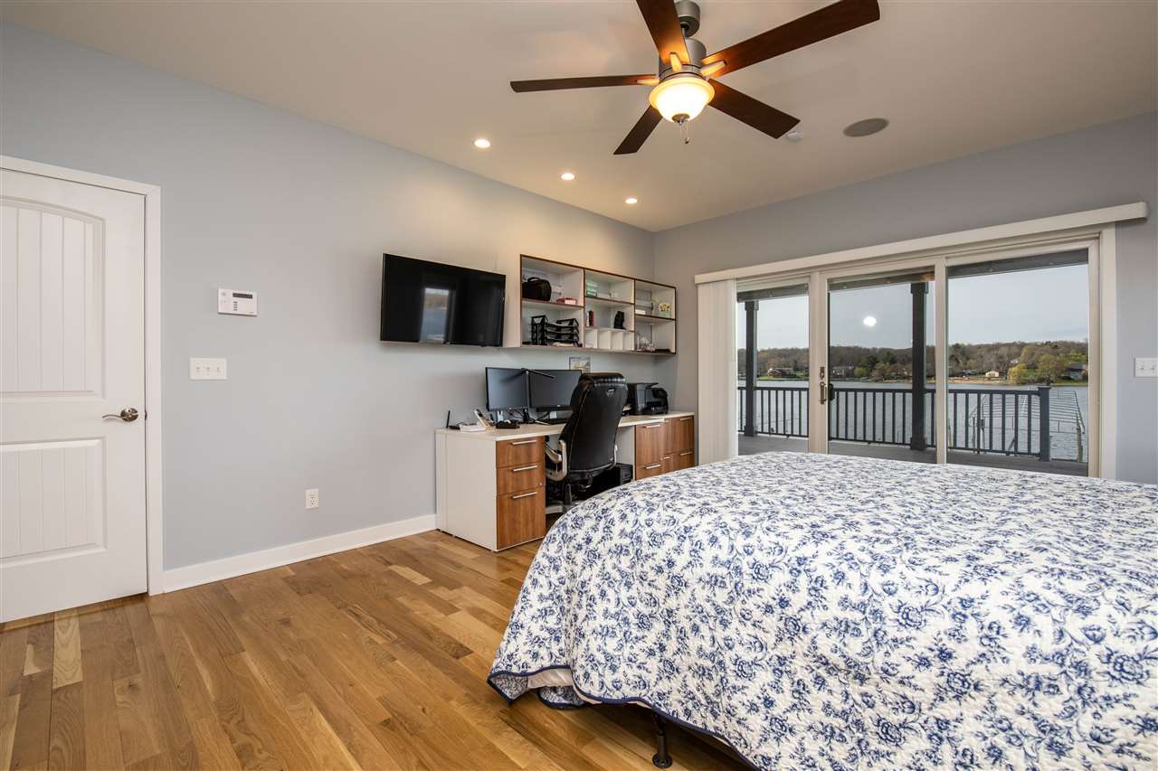 873 Breckenboro Road Davis, IL 61019 - Photo 16 of 41 a bedroom with a bed and a flat screen tv