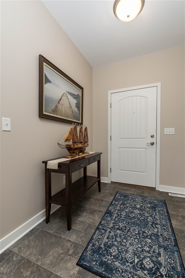 873 Breckenboro Road Davis, IL 61019 - Photo 23 of 41 a view of a hallway with paintings on the wall