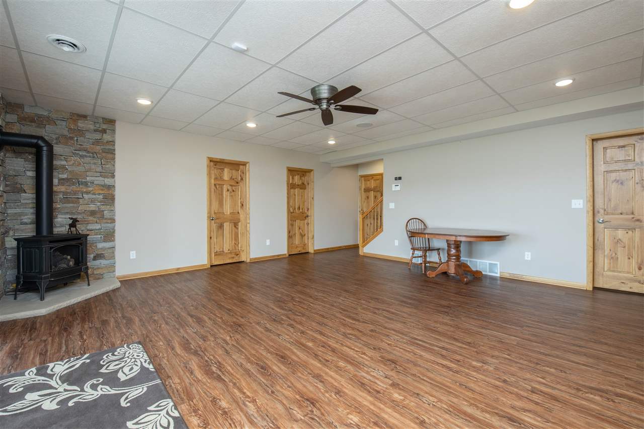 873 Breckenboro Road Davis, IL 61019 - Photo 24 of 41 a view of a livingroom with furniture and a ceiling fan