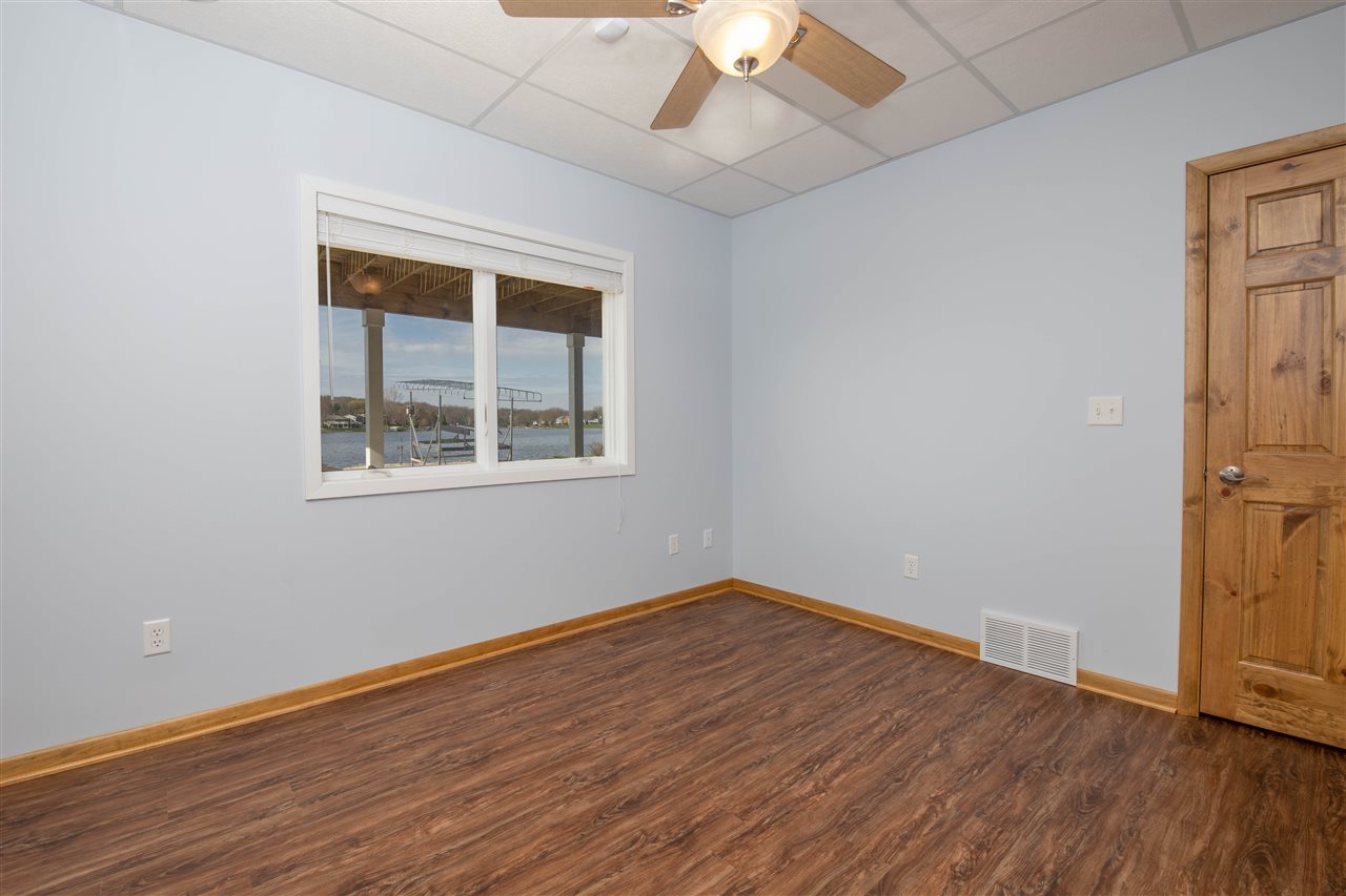 873 Breckenboro Road Davis, IL 61019 - Photo 31 of 41 a view of empty room with wooden floor and fan