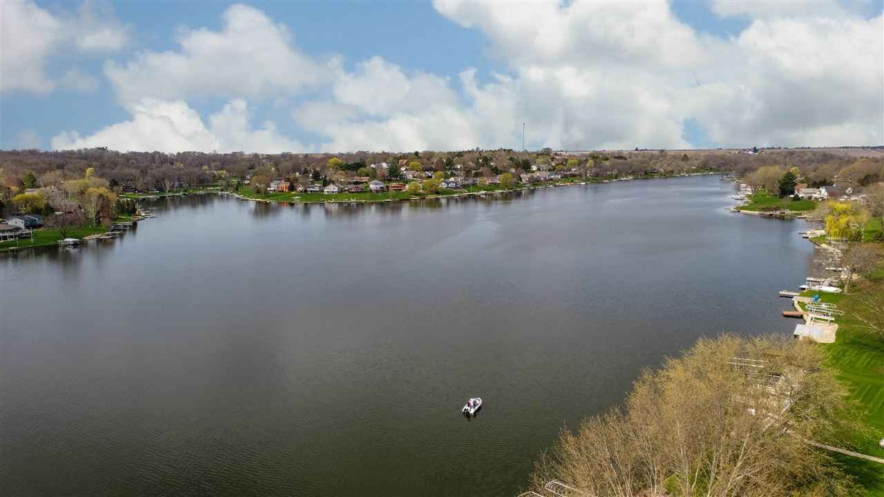 873 Breckenboro Road Davis, IL 61019 - Photo 40 of 41 a view of a lake with houses in the back