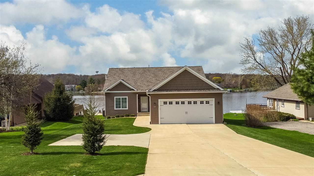 873 Breckenboro Road Davis, IL 61019 - Photo 8 of 41 a front view of a house with a garden