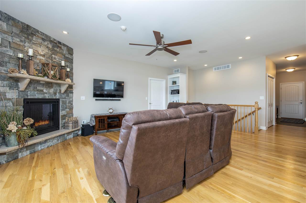873 Breckenboro Road Davis, IL 61019 - Photo 10 of 41 a living room with furniture a fireplace and a flat screen tv