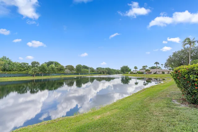 a view of a lake with houses in the back