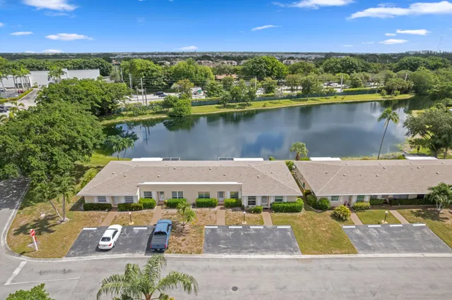 an aerial view of a house with a lake view
