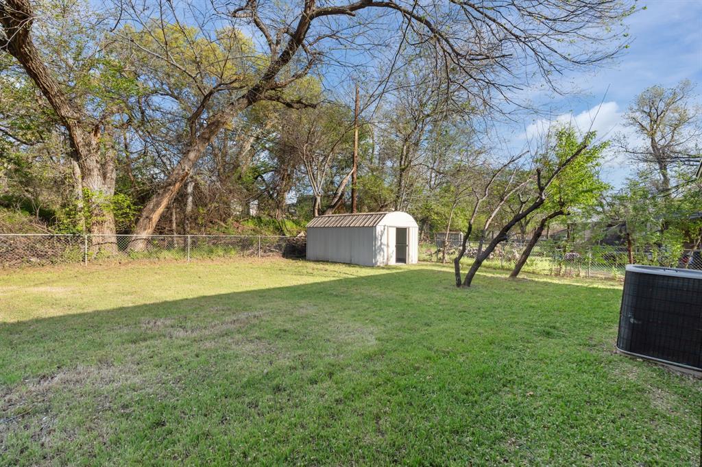 217 Clinton Drive Weatherford, TX 76086 - Photo 19 of 19 a view of a house with a yard