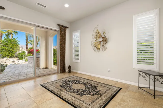 a living room with a rug