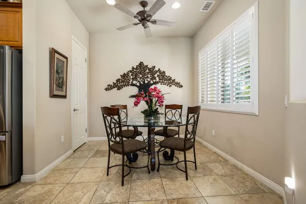 a dining room with furniture and window