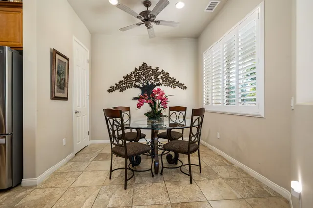 a dining room with furniture and window