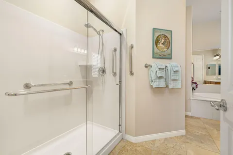 a bathroom with a shower and a sink