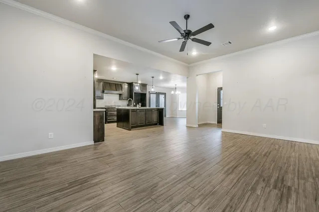 a view of a kitchen with a sink and a stove