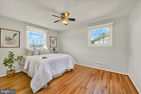 a bed room with a bed and a chandelier