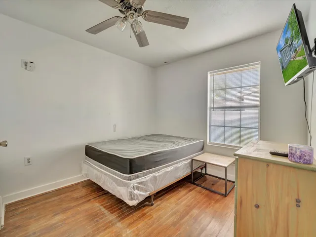 a room with a bed and a window