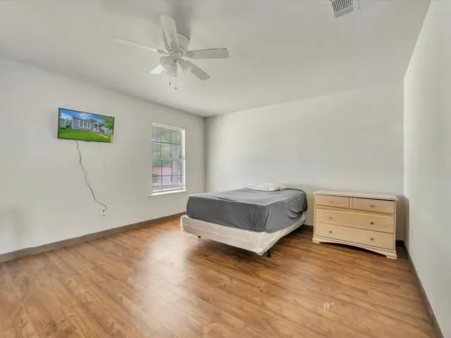 a bedroom with a bed and a cabinets