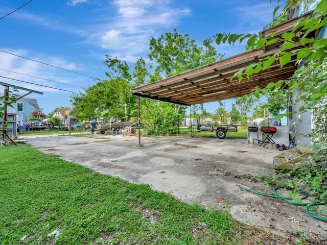 a view of a backyard with a patio