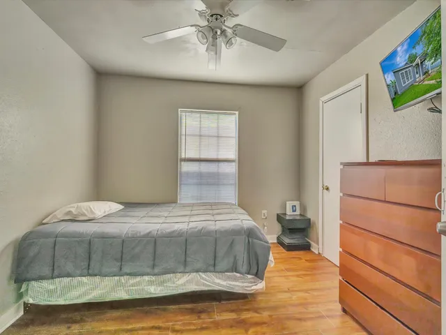 a bedroom with a bed and window