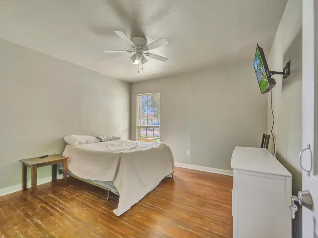 a living room with a bed furniture and a window