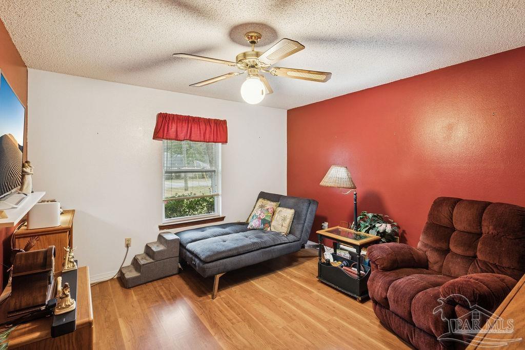 5132 Rowe Trail Pace, FL 32571 - Photo 15 of 26 a living room with furniture and a window