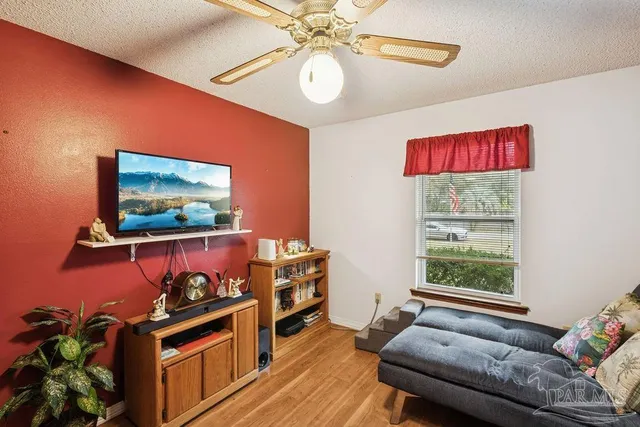 a living room with furniture and a flat screen tv