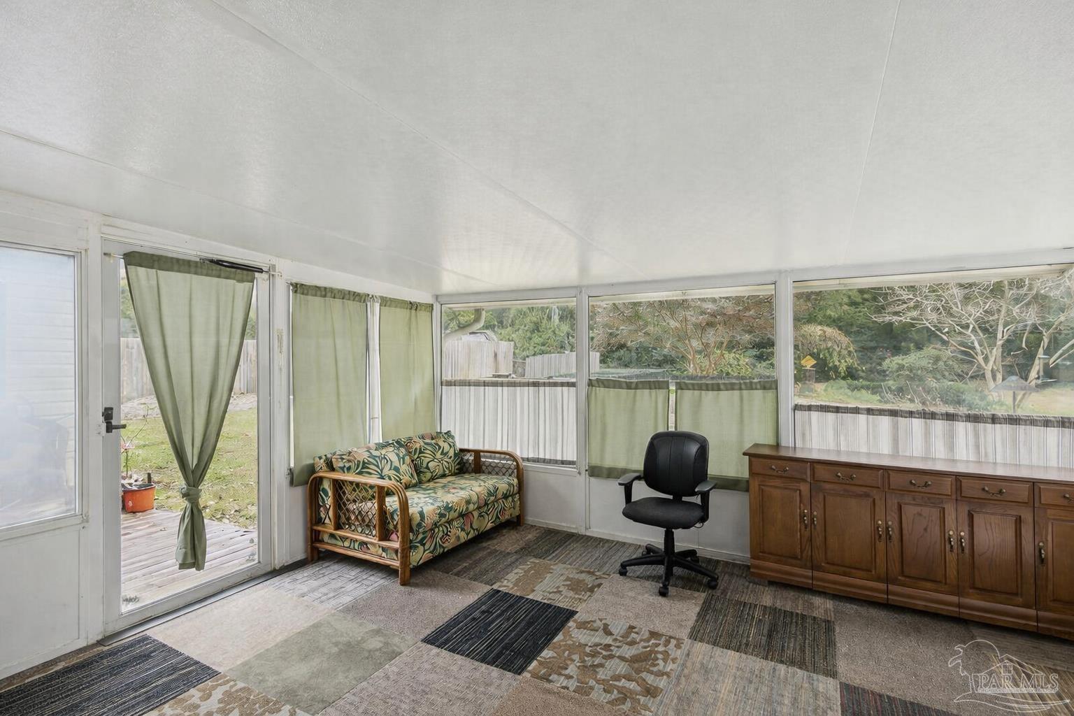 5132 Rowe Trail Pace, FL 32571 - Photo 21 of 26 a living room with furniture and a large window